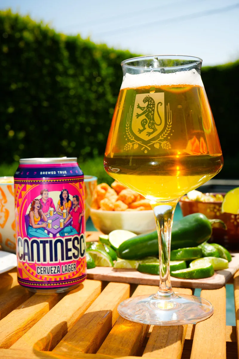 A poured glass of Cantinesca beside a bowl of jalapenos