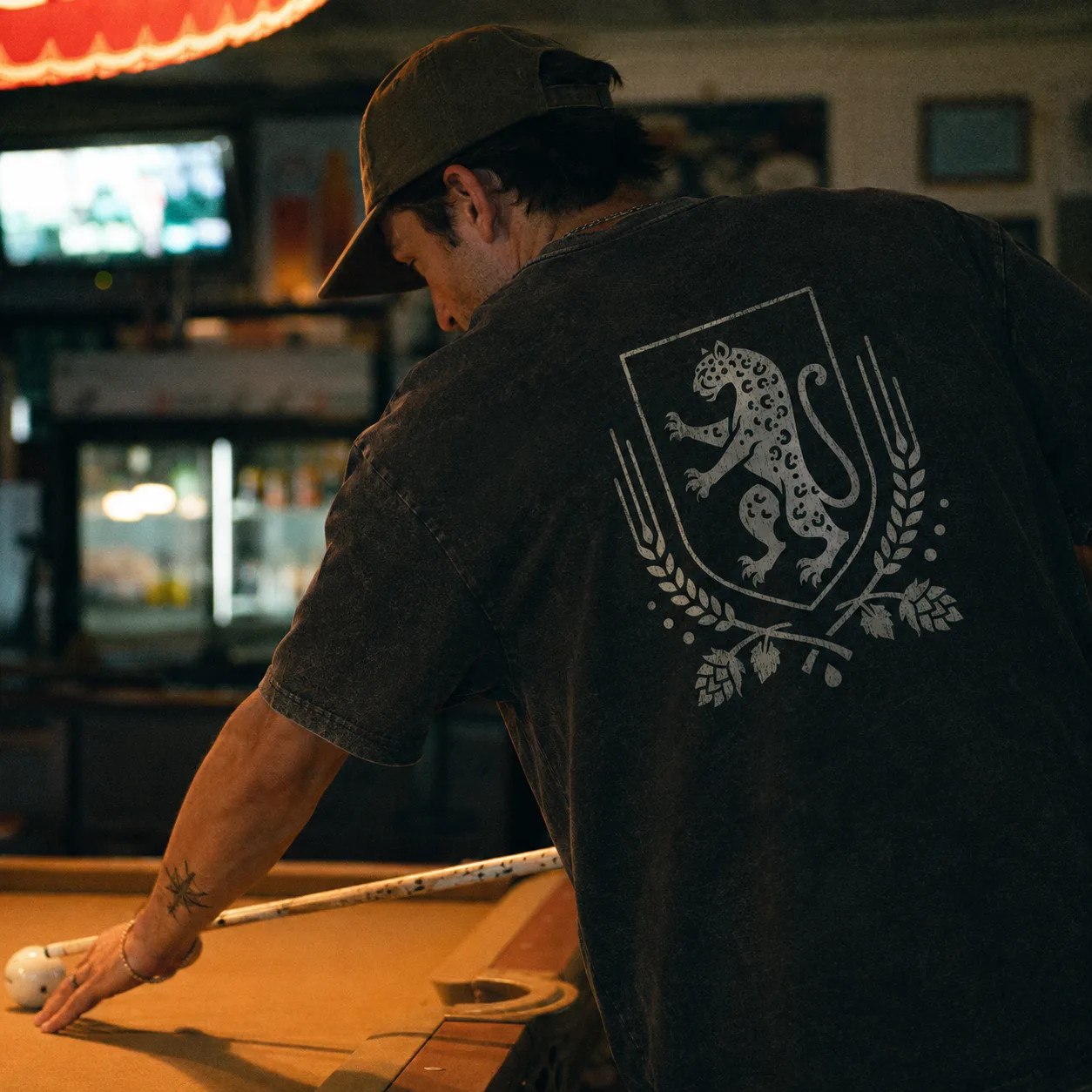 Wearing the Leopard Mark tee at the pool table